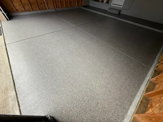 Garage floor in a dark grey flake finish