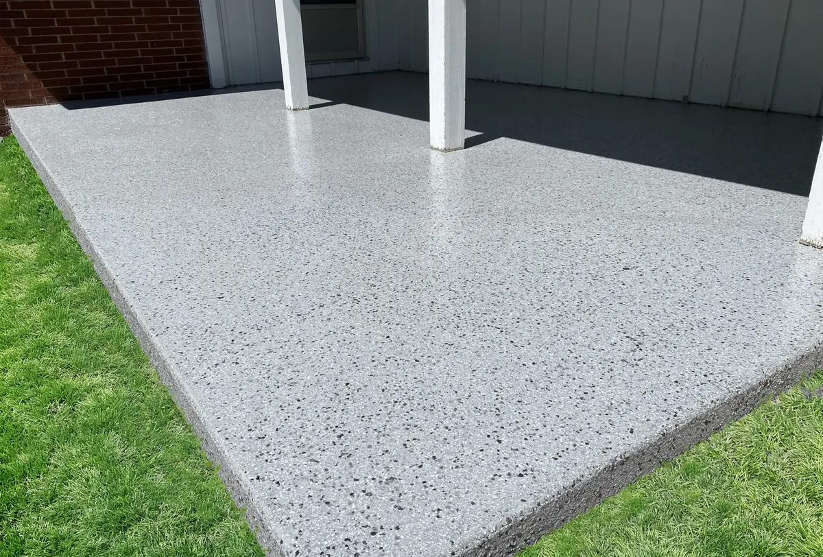 Covered porch slab coated in grey flake